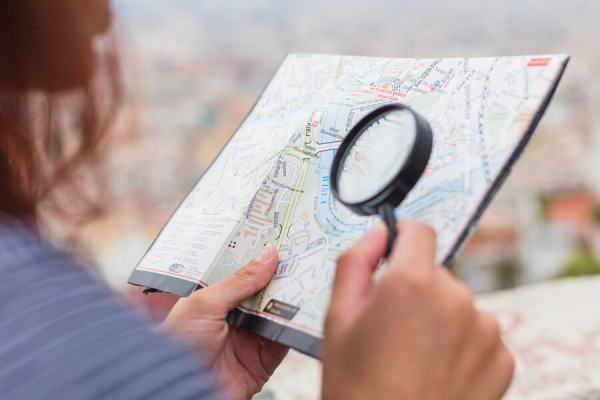 female tourist looking map 23 2147981967